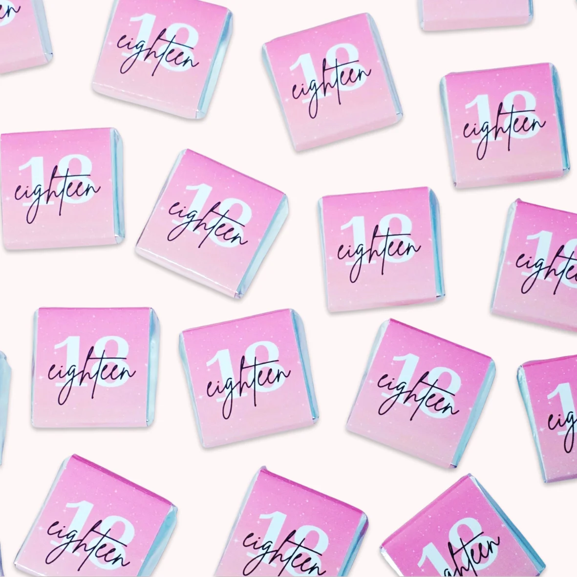 Personalised 18th birthday mini chocolate favours with pink labels and elegant “eighteen” design for party guests.
