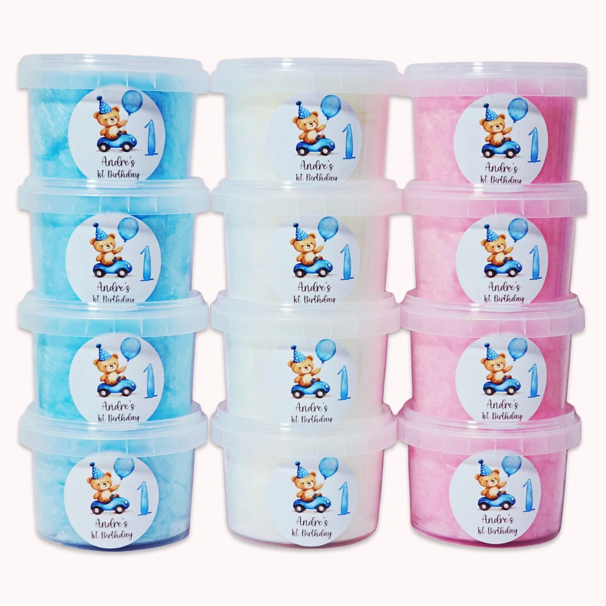Personalised fairy floss cotton candy party favours with teddy bear design for a first birthday celebration.