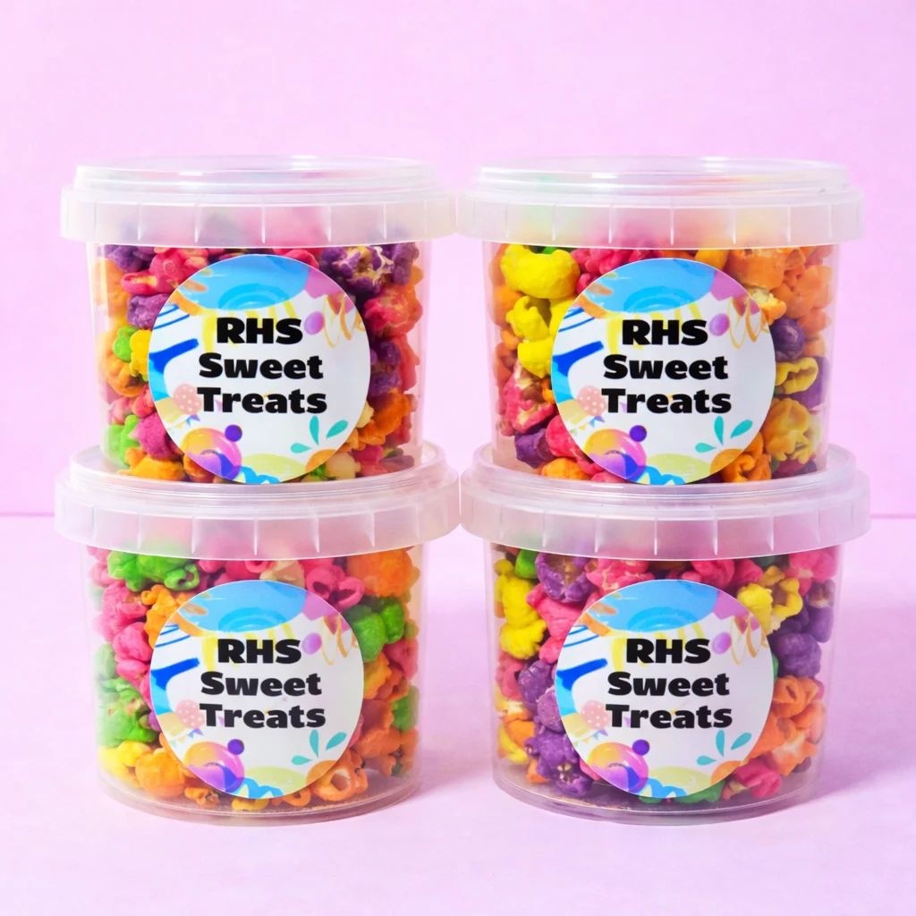 Personalised rainbow popcorn tubs with school event labels