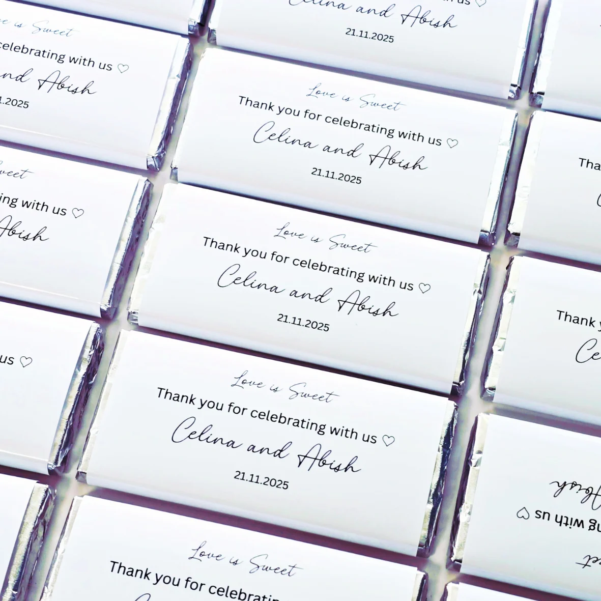 Elegant personalised chocolate bar wedding favours with minimalist thank you label design.