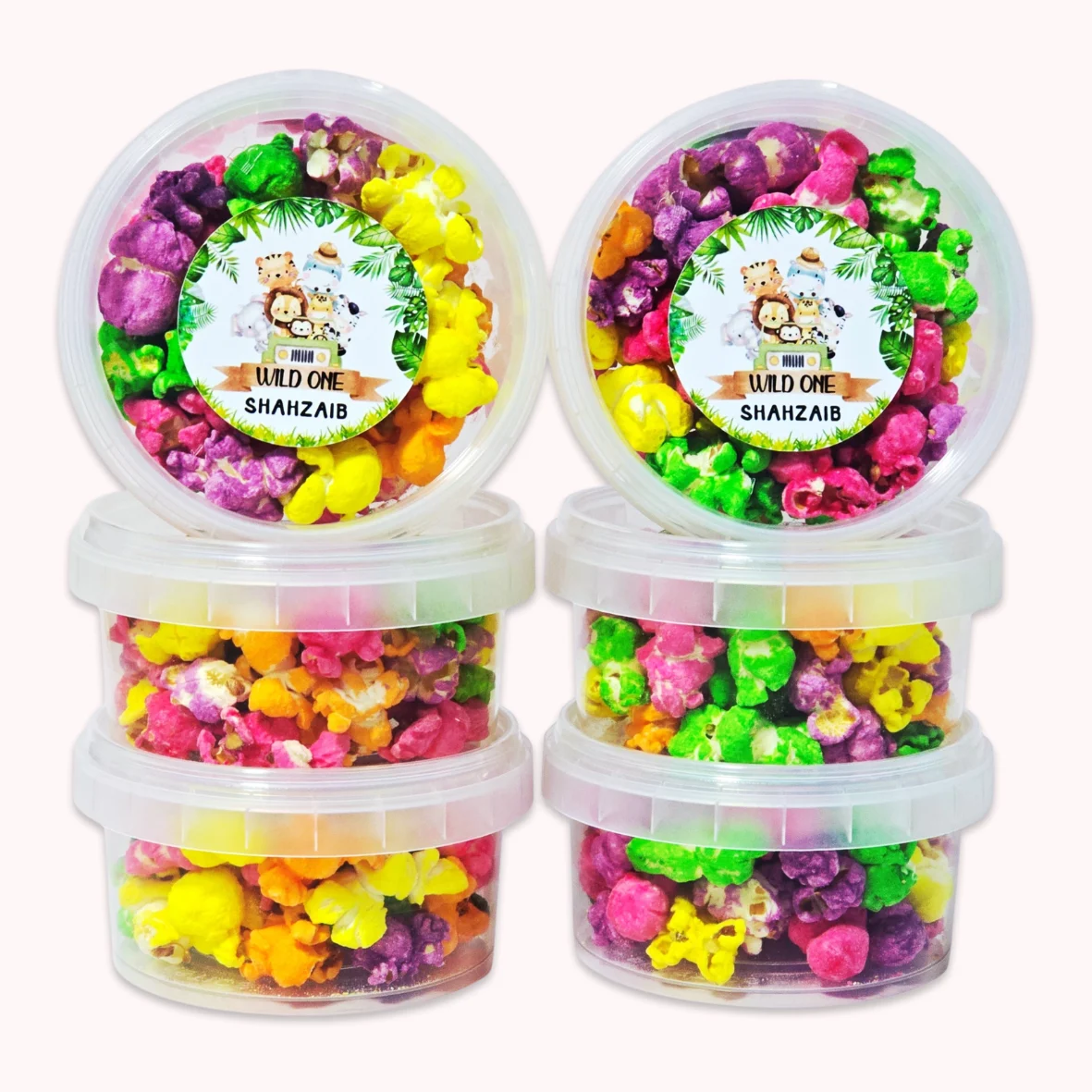 Personalised popcorn party favours with jungle safari theme label for a first birthday party.