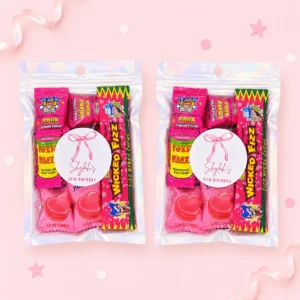 Bow personalised lolly bags prefilled with assorted lollies and finished with custom pink ribbon labels for a 12th birthday