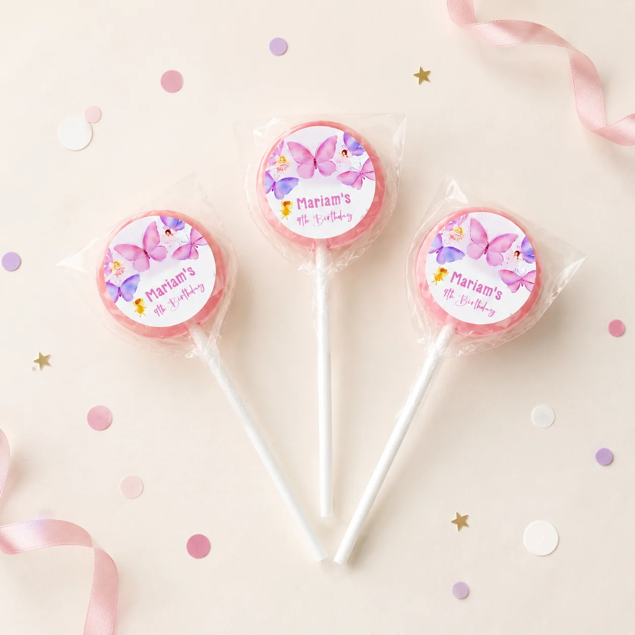 Butterfly personalised lollipops party favours with swirly lollipops and pink butterfly birthday labels