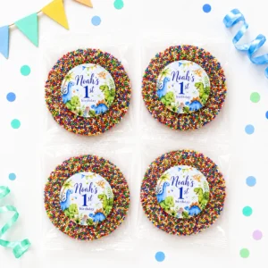 Dinosaur personalised giant freckles party favours with giant chocolate freckles, rainbow sprinkles and 1st birthday dino labels