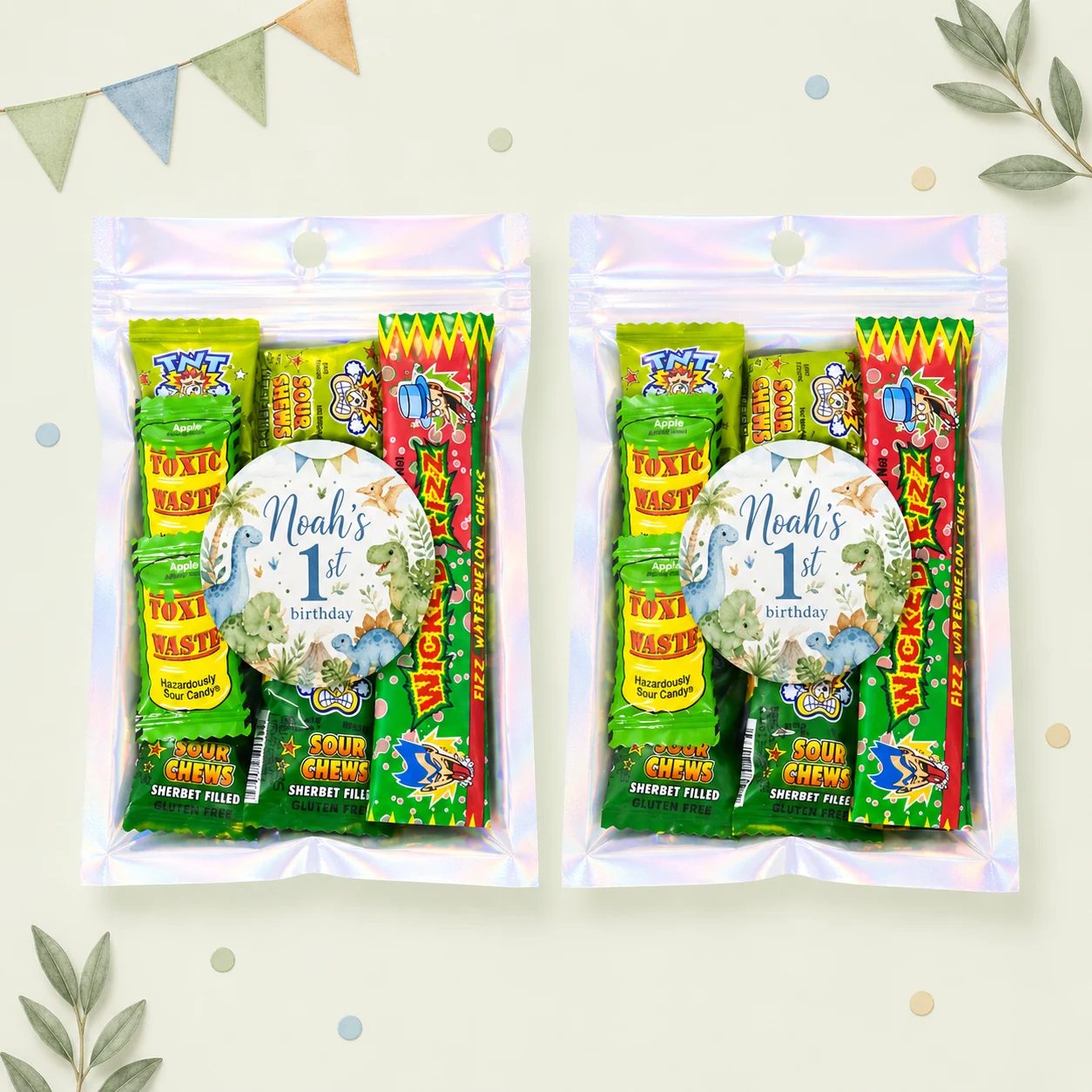 Dinosaur personalised lolly bags prefilled with assorted lollies and finished with custom dinosaur labels for a 1st birthday