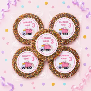 Dump truck personalised giant freckles party favours with individually packed giant chocolate freckles, rainbow sprinkles and pink 3rd birthday labels