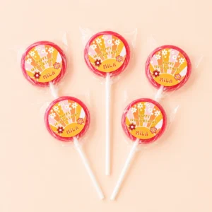Groovy personalised lollipops party favours with swirly lollipops and retro flower birthday labels