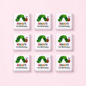 Hungry Caterpillar inspired personalised mini chocolates party favours with colourful 1st birthday wrappers