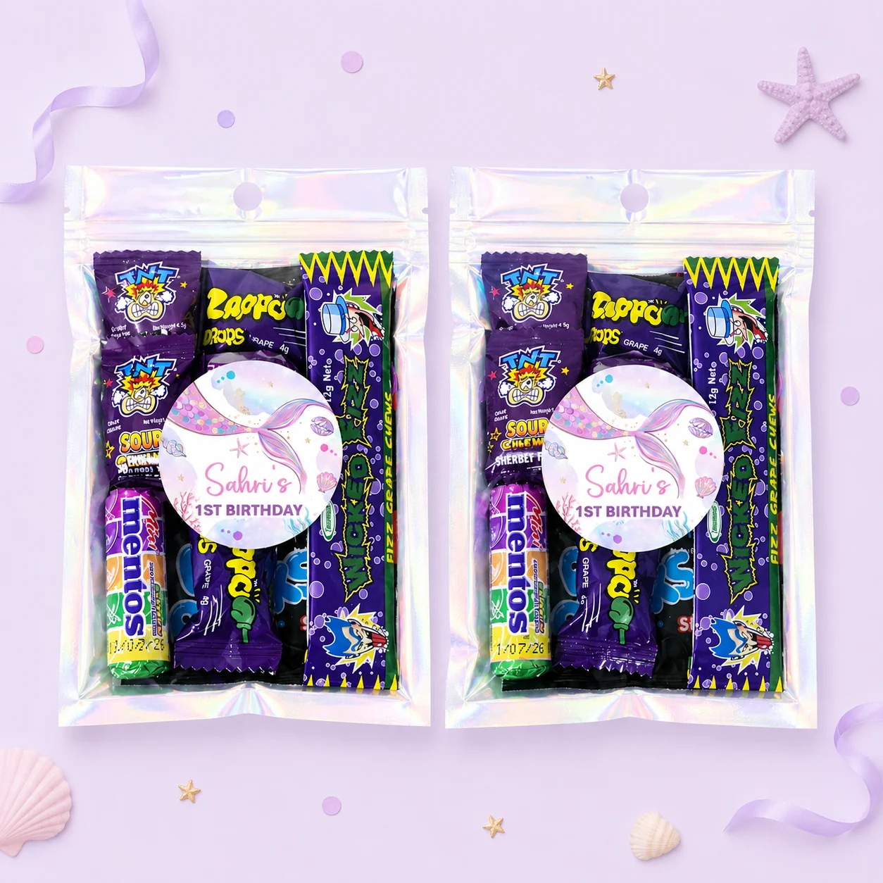 Mermaid personalised lolly bags prefilled with assorted lollies and finished with custom mermaid labels for a 1st birthday