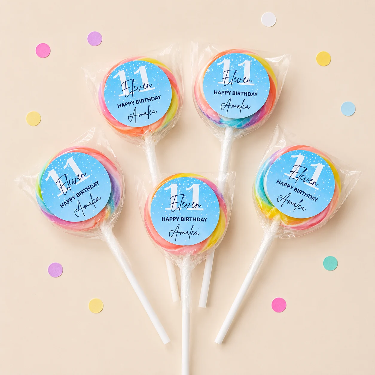 Milestone Birthday personalised lollipops party favours with swirly lollipops and blue 11th birthday labels