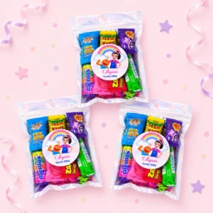 Ms Rachel inspired personalised lolly bags prefilled with assorted lollies and custom rainbow learning-show labels for a 1st birthday