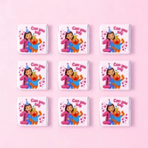Ms Rachel inspired personalised mini chocolates party favours with pink 1st birthday learning theme wrappers
