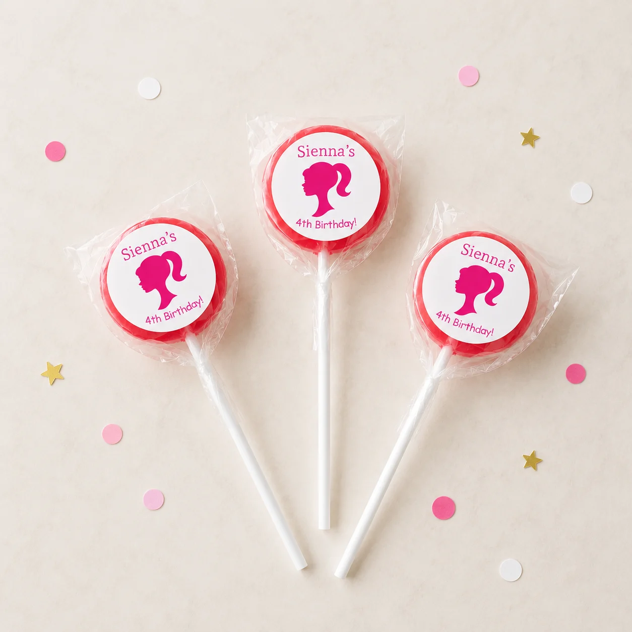Pink Doll personalised lollipops party favours with swirly lollipops and pink doll birthday labels