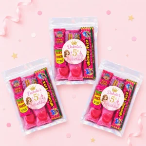 Princess personalised lolly bags prefilled with assorted lollies and finished with custom pink princess labels for a 5th birthday