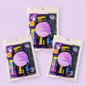 Glitter personalised lolly bags prefilled with assorted lollies and finished with custom purple glitter birthday labels
