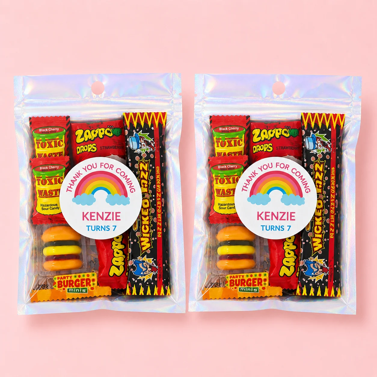 Rainbow personalised lolly bags prefilled with assorted lollies and custom thank-you rainbow labels for a 7th birthday