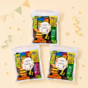 Safari personalised lolly bags prefilled with assorted lollies and finished with custom wild one safari labels for a 1st birthday