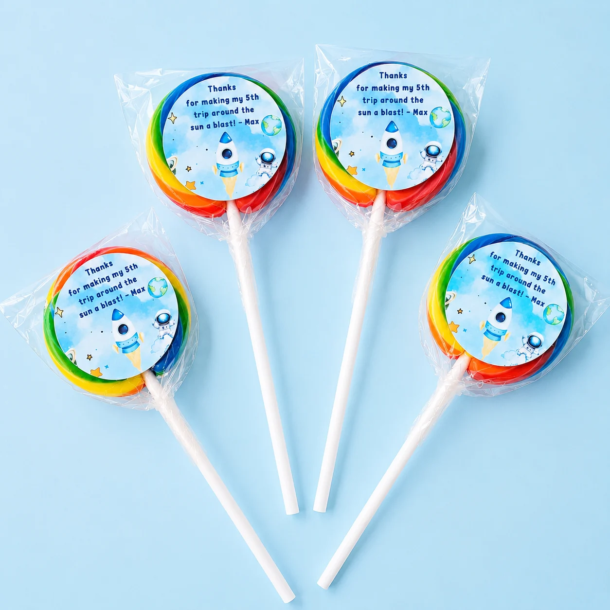 Space personalised lollipops party favours with swirly lollipops and rocket astronaut birthday labels