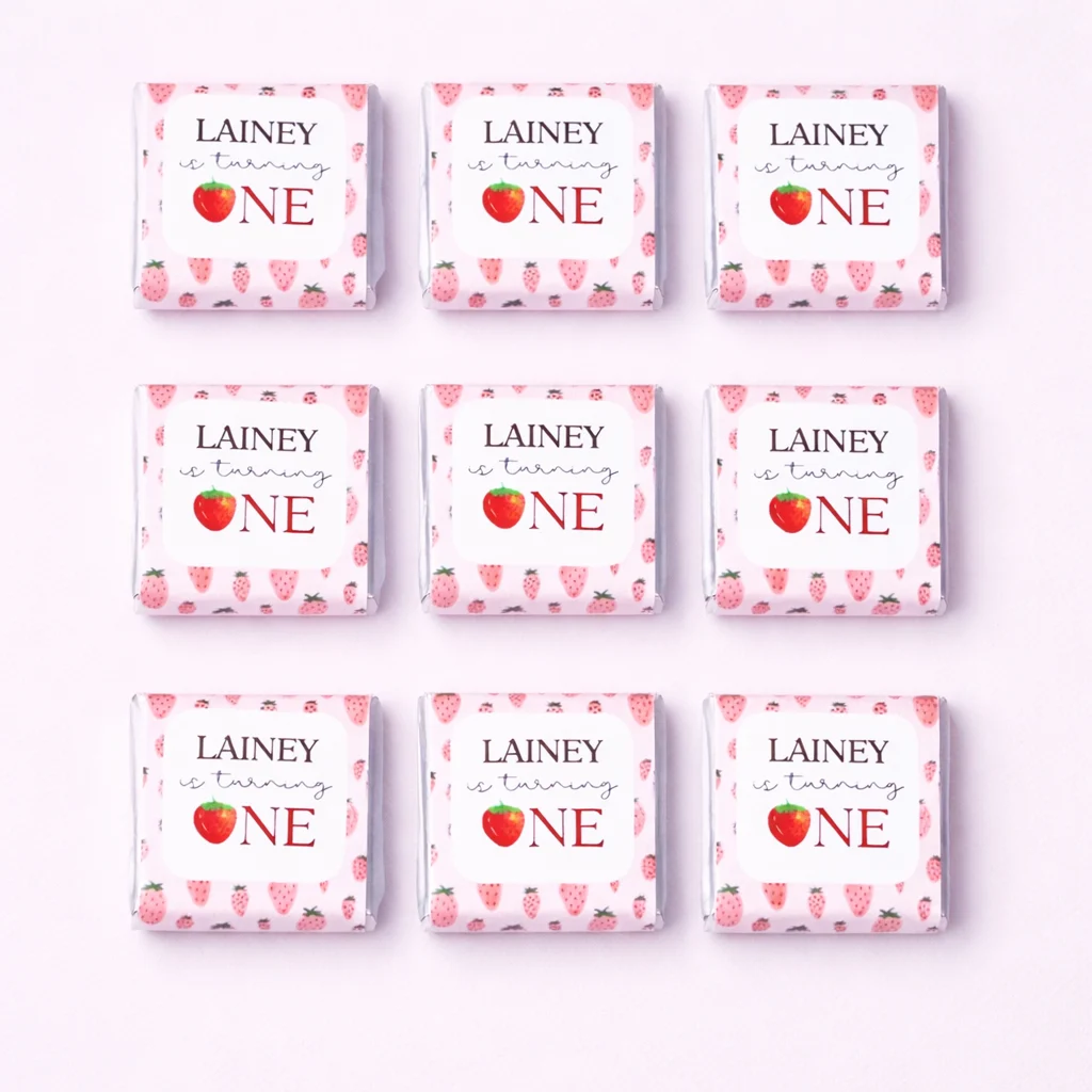 Strawberry personalised mini chocolates party favours with pink strawberry 1st birthday wrappers