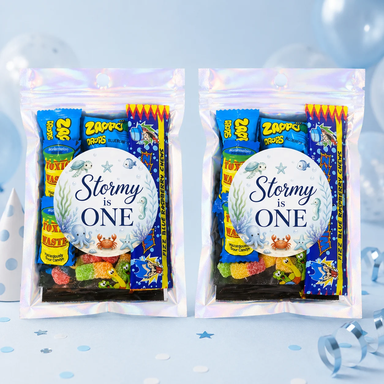 Under the sea personalised lolly bags prefilled with assorted lollies and finished with custom ocean animal labels for a 1st birthday