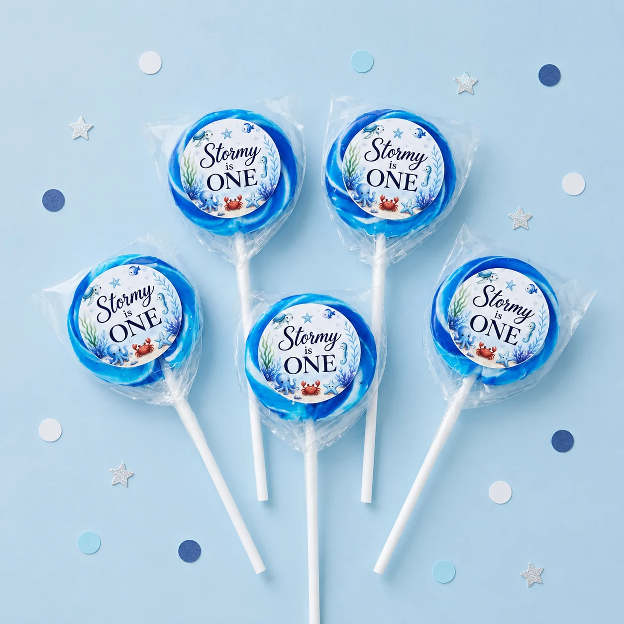 Under the Sea personalised lollipops party favours with swirly lollipops and ocean first birthday labels
