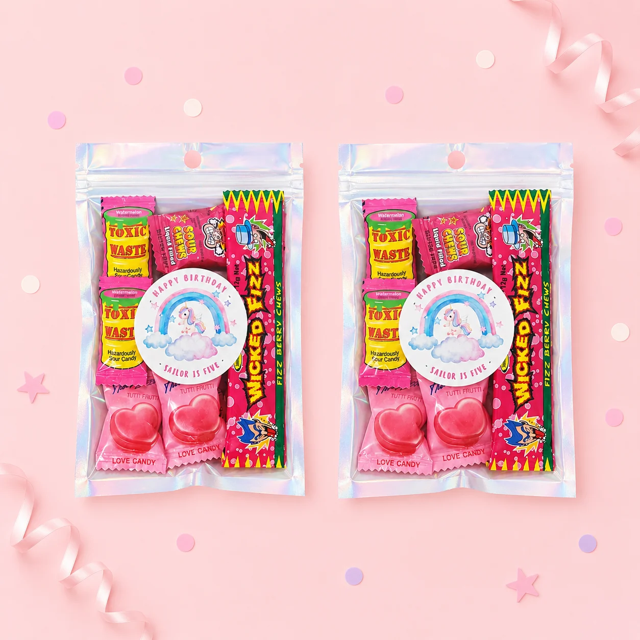 Unicorn personalised lolly bags prefilled with assorted lollies and finished with custom rainbow unicorn labels for a 5th birthday